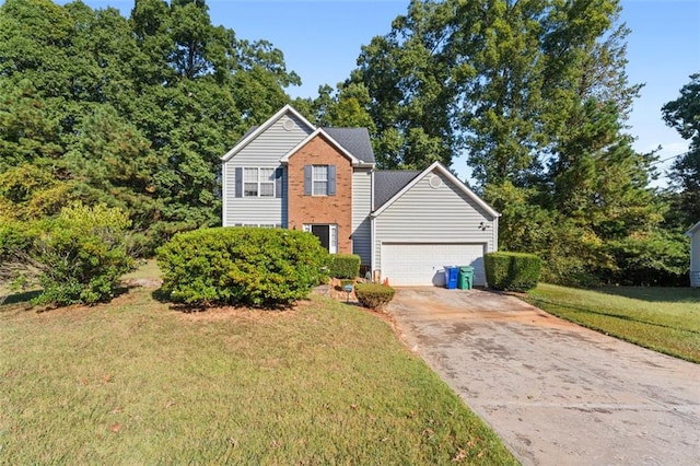 view of front of property with a garage and a front lawn