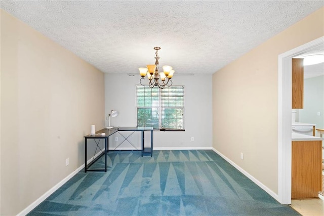 unfurnished dining area with a notable chandelier, carpet floors, and a textured ceiling