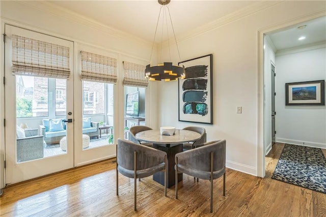 2313 Saint Davids Sq NW Unit 12, Kennesaw, GA 30152 - dining room with ornamental molding, wood finished floors, baseboards, a chandelier, and french doors