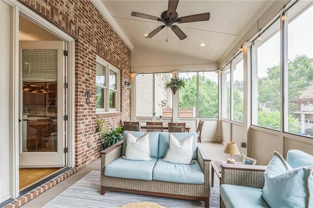 2313 Saint Davids Sq NW Unit 12, Kennesaw, GA 30152 - sunroom featuring brick wall, ceiling fan, vaulted ceiling, carpet, and an outdoor living space