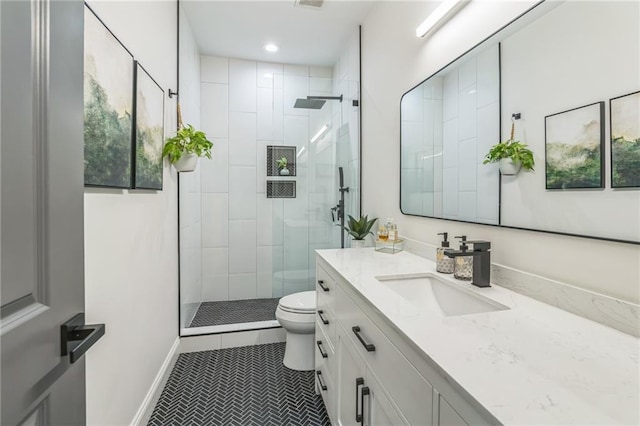 2313 Saint Davids Sq NW Unit 12, Kennesaw, GA 30152 - bathroom featuring toilet, a stall shower, tile patterned flooring, vanity, and recessed lighting
