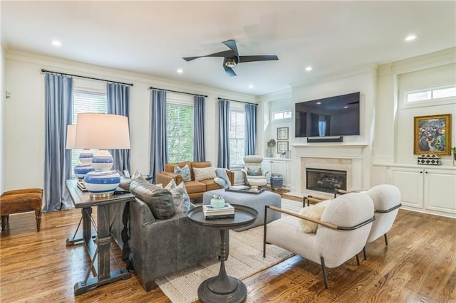 2313 Saint Davids Sq NW Unit 12, Kennesaw, GA 30152 - living area featuring crown molding, ceiling fan, wood finished floors, a fireplace, and recessed lighting