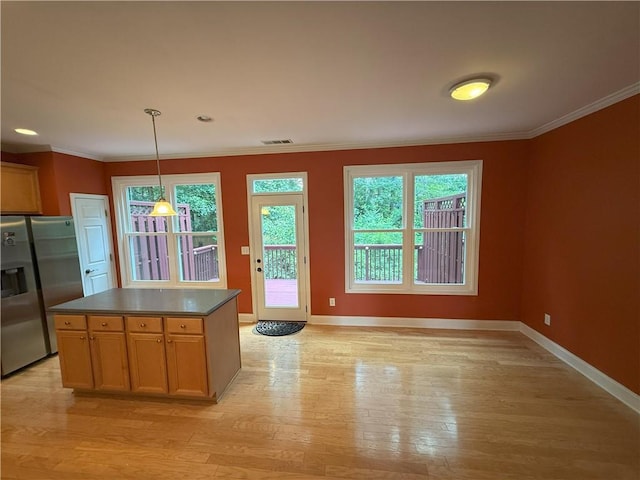 2895 Brandl Cove Ct Unit 4, Marietta, GA 30067 - kitchen with stainless steel fridge with ice dispenser, light wood-style flooring, crown molding, dark countertops, and decorative light fixtures