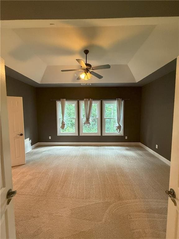 2895 Brandl Cove Ct Unit 4, Marietta, GA 30067 - empty room featuring a raised ceiling, light colored carpet, and ceiling fan