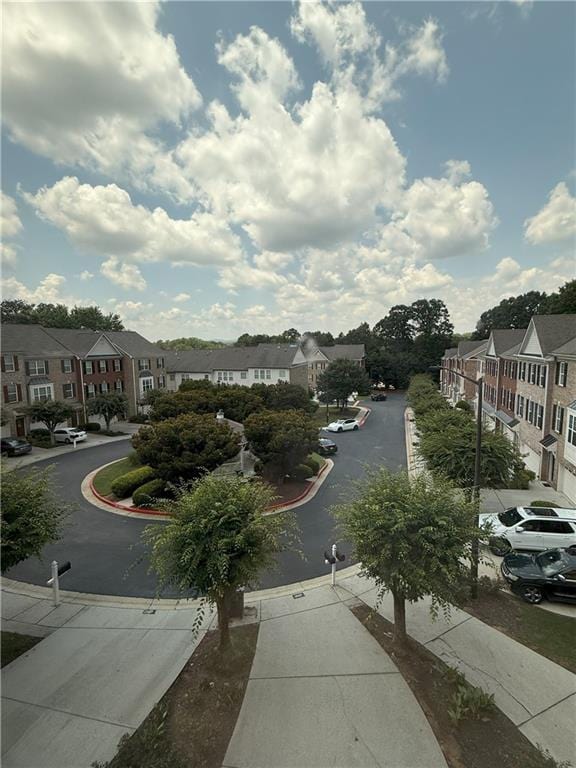 2895 Brandl Cove Ct Unit 4, Marietta, GA 30067 - view of asphalt road with sidewalks, a residential view, and curbs