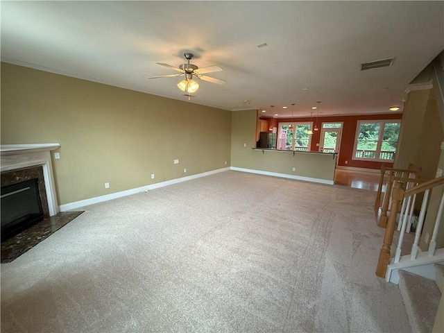 2895 Brandl Cove Ct Unit 4, Marietta, GA 30067 - unfurnished living room featuring carpet floors, a ceiling fan, crown molding, a fireplace, and stairway