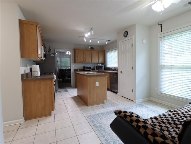 550 Sessingham Ct, Alpharetta, GA 30005 - kitchen with dishwashing machine, stainless steel microwave, a kitchen island, dark countertops, and light tile patterned floors