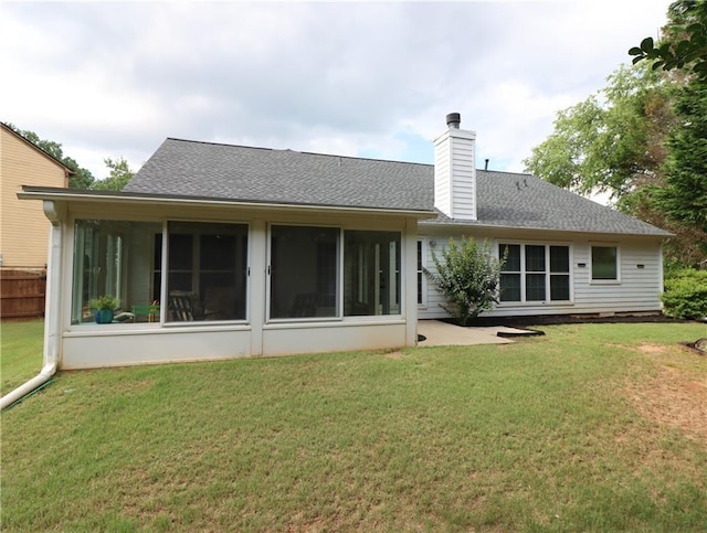 550 Sessingham Ct, Alpharetta, GA 30005 - back of property featuring a sunroom, a chimney, a patio, and a yard