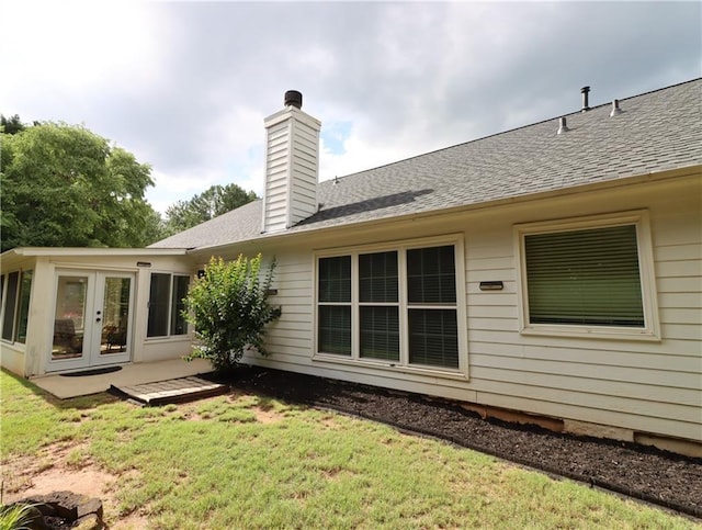 550 Sessingham Ct, Alpharetta, GA 30005 - back of property with french doors, a lawn, a chimney, and roof with shingles