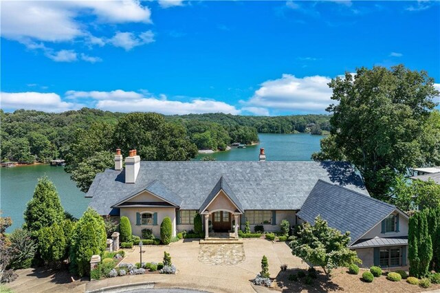 view of front of home with a water view