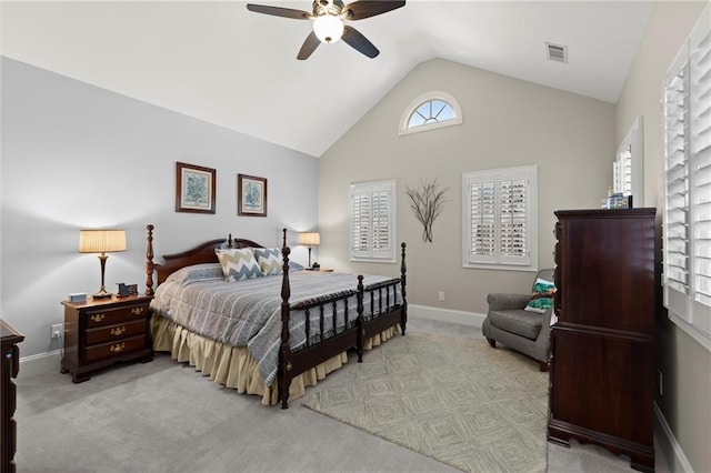 bedroom featuring baseboards, visible vents, a ceiling fan, light colored carpet, and vaulted ceiling