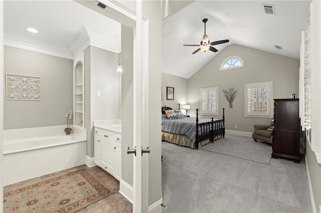 carpeted bedroom with baseboards, visible vents, vaulted ceiling, and crown molding