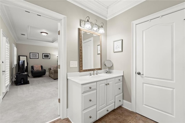 bathroom with baseboards, tile patterned flooring, vanity, and crown molding