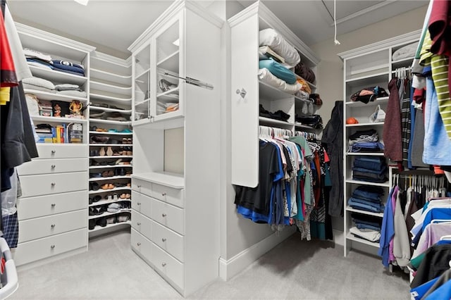 walk in closet with carpet and attic access