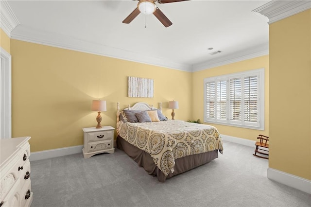 bedroom with ceiling fan, carpet flooring, visible vents, baseboards, and crown molding