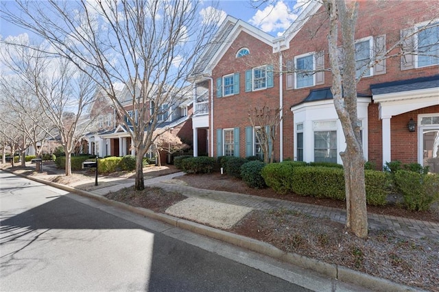 view of front of property with brick siding and a residential view