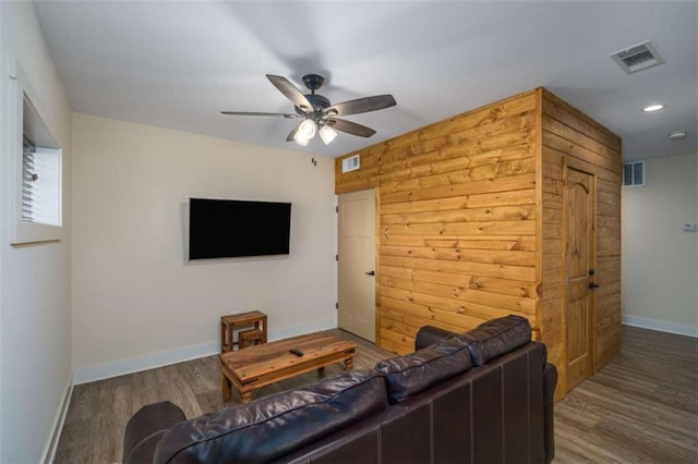 living room with hardwood / wood-style floors and ceiling fan