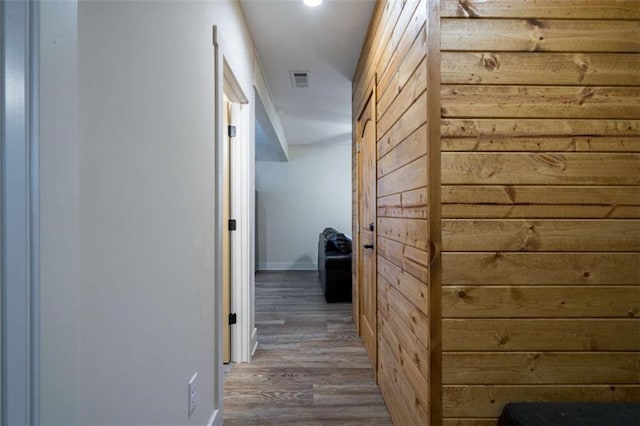 hallway with wood-type flooring