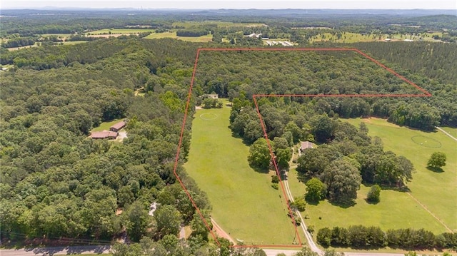 bird's eye view featuring a wooded view