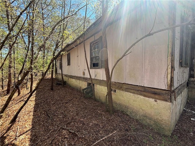 view of side of property with crawl space