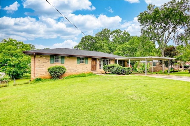 1342 Peggy Ln NW, Conyers, GA 30012 - view of front of property with driveway, a front lawn, brick siding, and an attached carport