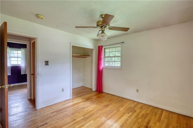 1342 Peggy Ln NW, Conyers, GA 30012 - unfurnished bedroom featuring light wood-style flooring, a closet, and ceiling fan