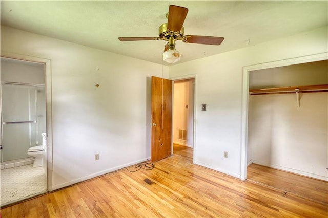 1342 Peggy Ln NW, Conyers, GA 30012 - unfurnished bedroom featuring light wood-type flooring, a closet, connected bathroom, and ceiling fan