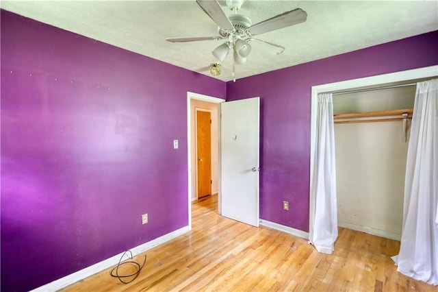 1342 Peggy Ln NW, Conyers, GA 30012 - unfurnished bedroom featuring wood finished floors, a closet, and ceiling fan