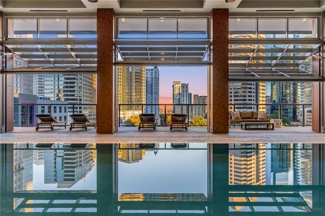 view of pool at dusk