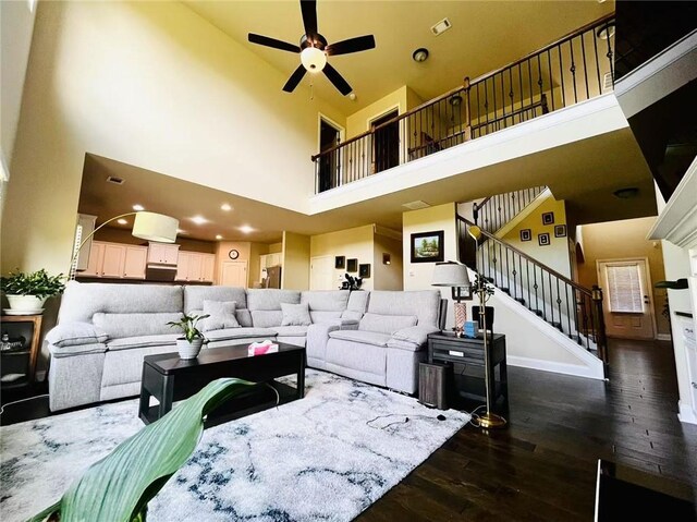 2579 Wimberley Pine Ct, Dacula, GA 30019 - living room with a high ceiling, hardwood / wood-style floors, stairway, and a ceiling fan