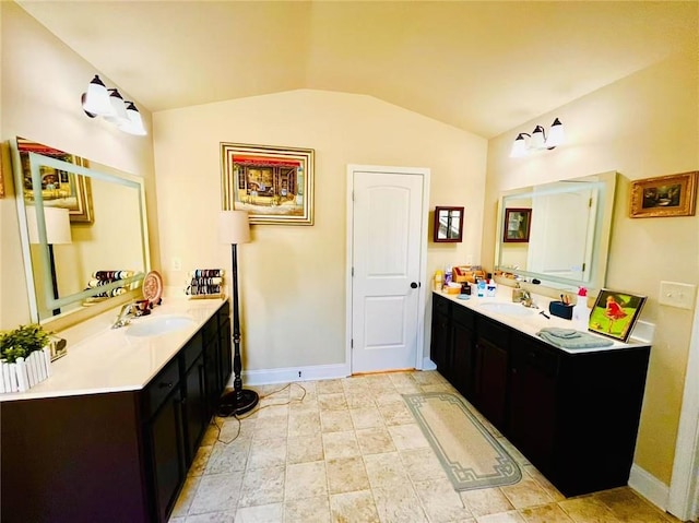 2579 Wimberley Pine Ct, Dacula, GA 30019 - full bath with vaulted ceiling, baseboards, and two vanities