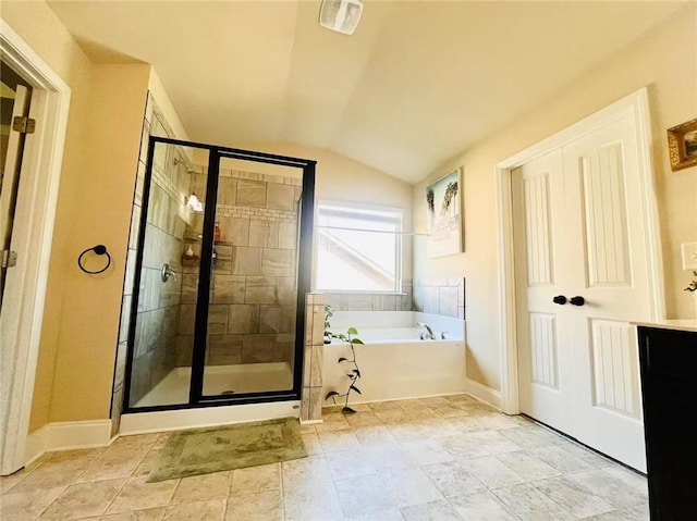 2579 Wimberley Pine Ct, Dacula, GA 30019 - full bathroom featuring a garden tub, a stall shower, lofted ceiling, and baseboards