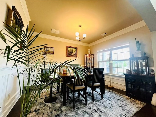 2579 Wimberley Pine Ct, Dacula, GA 30019 - dining space featuring a chandelier, crown molding, and wood finished floors