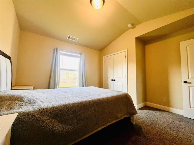 2579 Wimberley Pine Ct, Dacula, GA 30019 - bedroom with vaulted ceiling, carpet flooring, baseboards, and a closet
