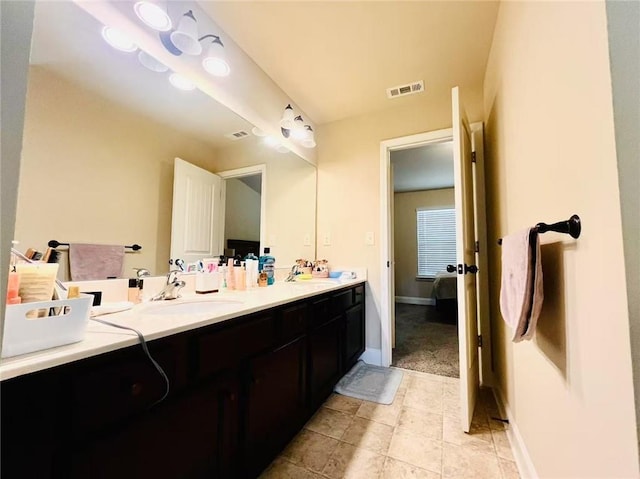 2579 Wimberley Pine Ct, Dacula, GA 30019 - bathroom featuring double vanity, tile patterned floors, and baseboards