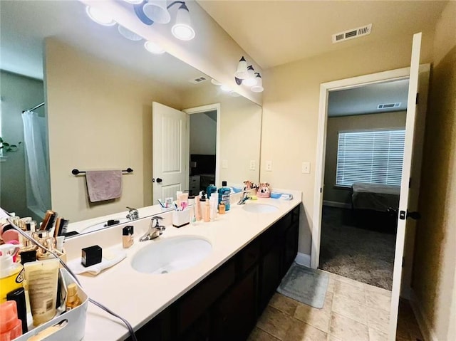 2579 Wimberley Pine Ct, Dacula, GA 30019 - bathroom with connected bathroom, double vanity, and baseboards