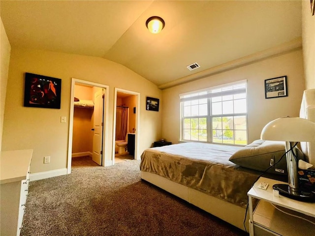 2579 Wimberley Pine Ct, Dacula, GA 30019 - bedroom with vaulted ceiling, carpet, baseboards, a walk in closet, and ensuite bathroom