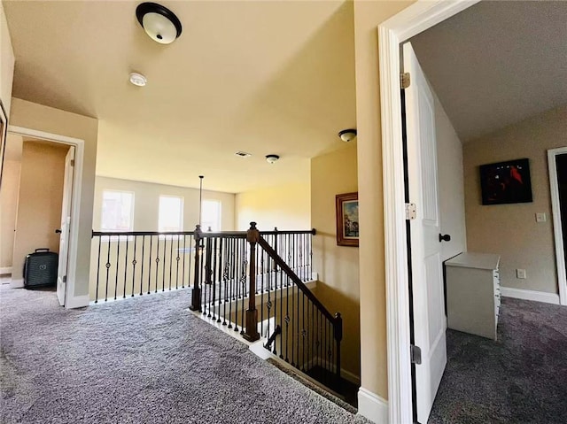 2579 Wimberley Pine Ct, Dacula, GA 30019 - corridor with carpet flooring, an upstairs landing, and baseboards