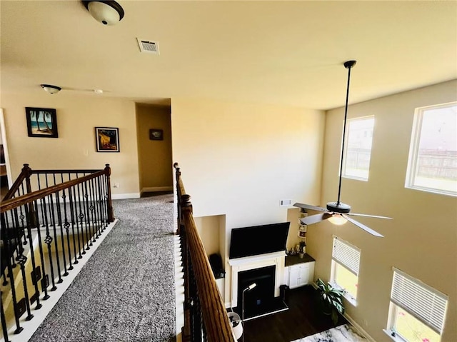 2579 Wimberley Pine Ct, Dacula, GA 30019 - corridor featuring an upstairs landing, plenty of natural light, and baseboards