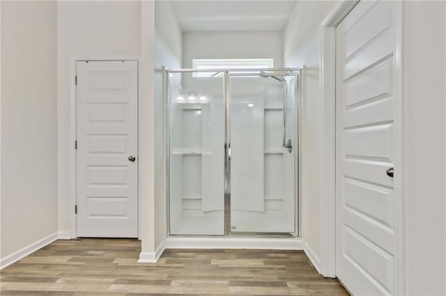 115 Copeland Bnd, Jasper, GA 30143 - bathroom featuring a stall shower, wood finished floors, and baseboards
