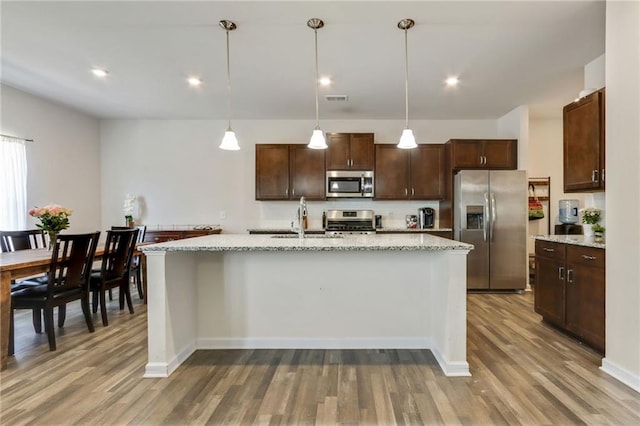 115 Copeland Bnd, Jasper, GA 30143 - kitchen featuring stainless steel appliances, wood finished floors, dark brown cabinets, and recessed lighting