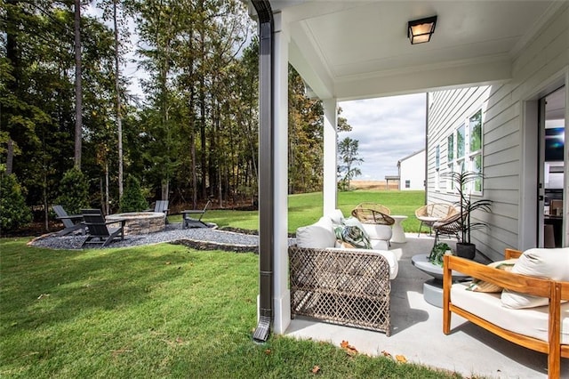 view of yard with a patio area and an outdoor living space with a fire pit