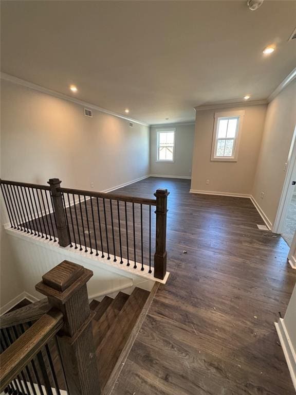 stairway featuring hardwood / wood-style flooring and ornamental molding