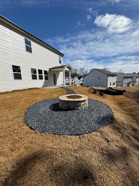 view of yard with an outdoor fire pit