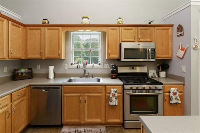 175 Prince Ct, Hiram, GA 30141 - kitchen with stainless steel appliances, a sink, light countertops, and brown cabinetry