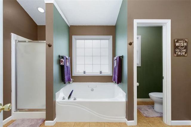 175 Prince Ct, Hiram, GA 30141 - bathroom with toilet, a garden tub, a shower stall, and baseboards