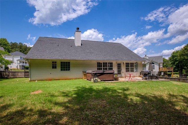 175 Prince Ct, Hiram, GA 30141 - rear view of house with a hot tub, a patio, and a chimney
