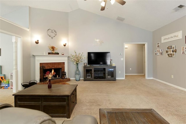 175 Prince Ct, Hiram, GA 30141 - living area featuring ceiling fan, light carpet, a fireplace, high vaulted ceiling, and baseboards