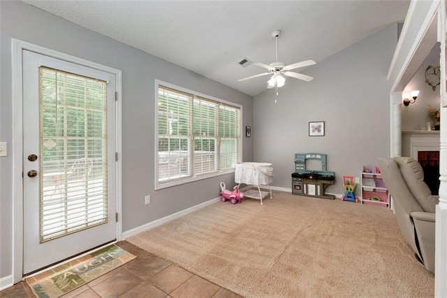 175 Prince Ct, Hiram, GA 30141 - rec room with lofted ceiling, ceiling fan, a fireplace, carpet floors, and baseboards