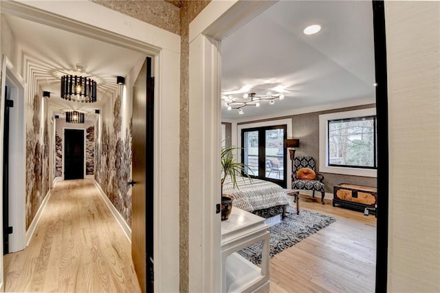 hallway with french doors and light wood-type flooring